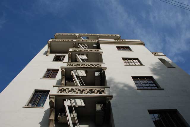 Excerpt from The Drop
(Photo by Terrill Lee Lankford)
Marmont Lane was steep and narrow as it curved around the hotel. They came to the death scene at the northwestern corner of the hotel. The forensic team had put up a canopy over the scene to guard against visual intrusion from media choppers and the houses that terraced the hills behind the hotel.
Before stepping under the canopy Bosch looked up the side of the hotel. He saw a man in a suit leaning over the balustrade, looking down from a balcony on the top floor. Chateau Marmont Balconies