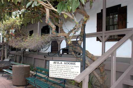 Excerpts From The Closers (Photo by Wendy Werris)
Rider made a move to turn down Arcadia but Bosch pointed toward the old pueblo, the place where the City Of Angels was founded. He wanted to take the long way and walk through.
Bosch studied the mud-walled structure behind the musician and wondered if Don Francisco Avila had any idea what he was helping to set in motion when he staked his claim to the spot in 1818. A city would grow tall and wide from this spot. A city as great as any other. And just as mean. A destination city, a city of invention and re-invention. A place where the dream seemed as easy to reach as the sign they put up on the hill, but a place where the reality was always something different. The road to that sign on the hill had a locked gate across it. Avila Adobe