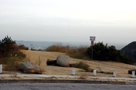 Excerpt From The Overlook (Photo by Wendy Werris)
After passing the reservoir he took Tahoe Drive farther up into the hills and then connected with the eastern terminus of Mulholland Drive. There was an unofficial overlook of the city here. It was posted with No Parking and Overlook Closed at Dark signs. But these were routinely ignored at all hours of the day and night. The Overlook