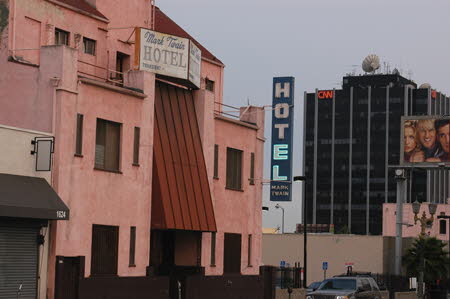 Excerpt From The Overlook (Photo by Wendy Werris)
Bosch and Ferras stepped out the front door of the Mark Twain Hotel and surveyed the morning. The light was just beginning to enter the sky. The marine layer was coming in gray and thick and was deepening the shadows in the streets. It made it look like a city of ghosts and that was fine with Bosch. It matched his outlook.
"You think he'll stay put?" Ferras asked.
Bosch shrugged.
"He's got no place else to go," he said.
They had just checked their witness into the hotel under the alias Charles Dickens. Mark Twain Hotel