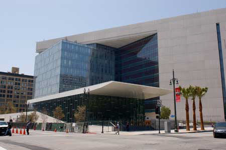 Excerpt from Nine Dragons (photo credit: Wendy Werris)
Harry went down to the cafeteria, which had opened at seven but was empty because the bulk of the police department's personnel were still working out of Parker Center. The move to the new Police Administration Building was progressing slowly. First some detective squads, then administrators and then the rest. It was a soft opening and the building would not be formally dedicated for another two months. For now it meant there were no lines in the cafeteria but there wasn't a full menu either. Bosch got the cop's breakfast; two donuts and a coffee. New Police Administration Building in Los Angeles