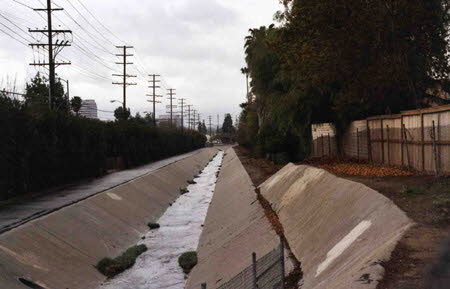 Excerpt From The Narrows (Photo by Wendy Werris)
"The river," Bosch said.
"What?"
"I told you, Valerio cuts across the whole Valley. But so does the river. So he's probably figuring out a way to get around it. The river cuts off all these streets in here. He probably has to get to Valerio on the other side."
"I don't see a river up there. I see a fence and concrete."
"It's not what you would consider a river. In fact, technically, that isn't the river. It's probably either the Aliso or Brown's Canyon wash. It goes to the river."
They waited.
"The river used to flood in storms like this. It would wipe out a third of the city. So they tried to control it. Contain it. Somebody had the idea to capture it in stone, put it in concrete. So that's what they did and everybody's house and home was supposedly safe after that."
"I guess that's called progress." The Narrows