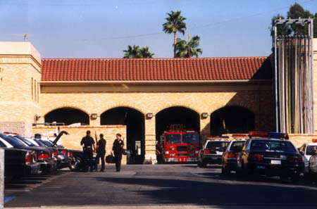 Bosch closed the binders and put them in his briefcase. He turned off the TV and headed out to the back parking lot. He held the station door for two uniform cops who were wrestling with a handcuffed drunk. The drunk threw a kick out at him but Harry stepped outside of its reach. Hollywood Police Station