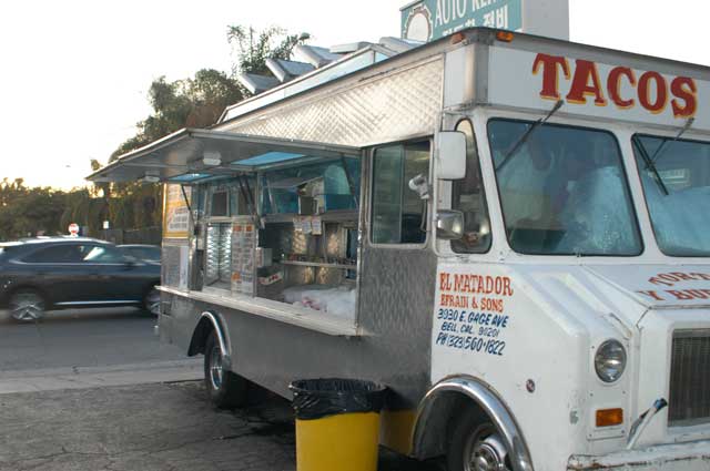 Excerpt from The Drop
(Photo by Wendy Werris)
“Good salsa,” he said. “You ever been to the El Matador truck in East Hollywood?”
“No, where’s it at?”
“Western and Lex. This is good but El Matador, I think they’re the best. He’s only there at night, though, and everything tastes better at night anyway.”
“Isn’t it weird how Western Avenue is in East Hollywood?”
“I never thought about it. The point is, next time you’re over there after work, try El Matador and tell me what you think.”
Bosch realized he had not been down to the El Matador truck since his daughter had come to live with him. At the time he didn’t think eating in or on cars and getting food from trucks had been right for her. Now maybe things were different. He thought she might enjoy it and he made a plan to take Maddie to El Matador over the weekend. El Matador
