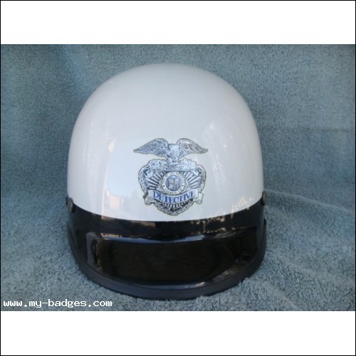 Excerpt from The Black Box
Bosch reached down to the floorboard and grabbed the white riot helmet he had been issued at roll call. The order was to wear it at all times while on duty. He thought the shiny white plastic, more than anything else, made them targets. LAPD Riot Helmet